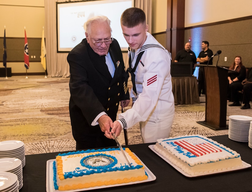 Retired Master Chief Petty Officer Charles Brent and Seaman Joshua Clark, a fireman student assigned to the Navy Nuclear Power Training Command, cut a cake during the Joint Base Charleston Navy Ball Oct. 13, 2019 at the Charleston Area Convention Center, S.C. It is tradition for the youngest and oldest Sailors in the room to cut the cake. Service members attended the ball to celebrate the Navy’s 244th birthday.