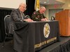 Retired Gen. Carter Ham, president and CEO, Association of the United States Army, and Maj. Gen. Frank Muth, commanding general, U.S. Army Recruiting Command, sign a memorandum of understanding during the AUSA Conference in Washington, D.C. today. This event formalizes a partnership between the two organizations to establish a cooperative framework for outreach.