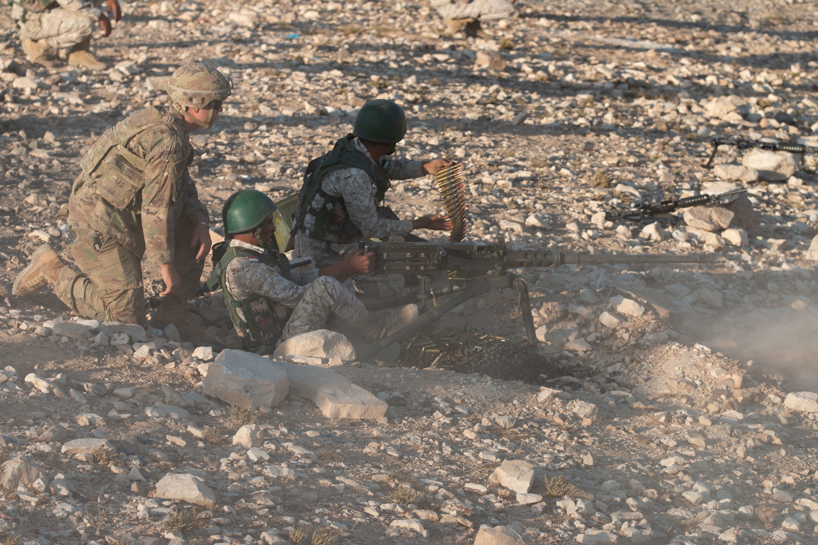 New Jersey National Guard Soldiers, with 1st Squadron, 102nd Calvary Regiment, 44th Infantry Brigade Combat Team of the 42nd Infantry Division, watch as Jordan Border Guard Force Soldiers, with the 7th Mechanized Battalion, 48th Mechanized Brigade, fire live ammunition at a range during a Jordan Operational Engagement Program (JOEP) training cycle at Joint Training Center-Jordan in September 2019. Jordan and the United States have a strong and enduring partnership in regard to joint training and the JOEP further cements that partnership through persistent training with the Border Guard Forces, Quick Reaction Forces and the 77th Marine Battalion. (U.S. Army photo by Maj. David Zuzak)