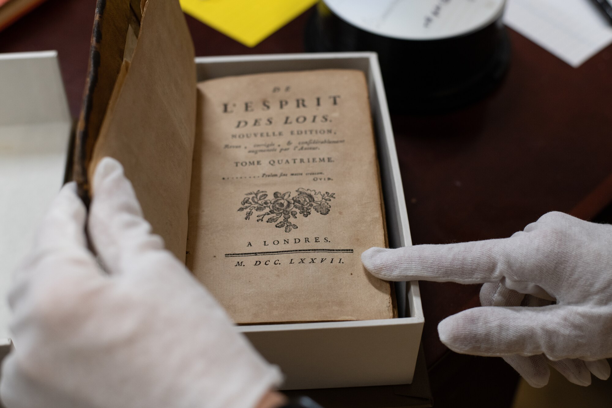 An Air University Library employee showcases one of the oldest books in the library’s collection, which they claim dates back to as early as 1611, Aug. 22, 2019, on Maxwell Air Force Base, Alabama. In addition to this book, the library has a vast collection of historical research and products that they are currently digitizing, which will soon be made available to Air Force and DOD employees around the world.