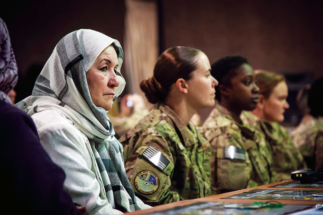 Women from the Afghan Air Force and International Security Assistance Force Afghanistan listen to presentations made during an International Women????????s Day celebration at Kabul International Airport March 7, 2013. The celebration highlighted the contributions afghan women make towards building a better and stronger Afghan Air Force. (U.S. Air Force Photo By: SSgt Dustin Payne, ISAF HQ Public Affairs)