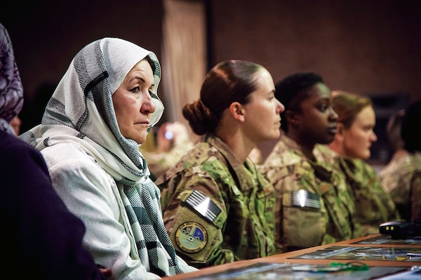 Women from the Afghan Air Force and International Security Assistance Force Afghanistan listen to presentations made during an International Women????????s Day celebration at Kabul International Airport March 7, 2013. The celebration highlighted the contributions afghan women make towards building a better and stronger Afghan Air Force. (U.S. Air Force Photo By: SSgt Dustin Payne, ISAF HQ Public Affairs)