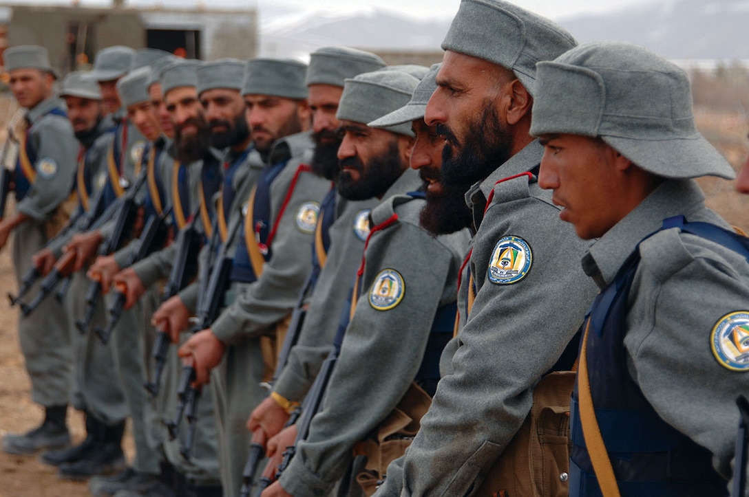 Afghanistan National Police (ANP) recruits listen to instructors before firing their AK-47 rifles at a range near the regional training center for the ANP near Gardez, Afghanistan, March 17, 2007. (U.S. Army photo by Staff Sgt. Michael Bracken) (Released)