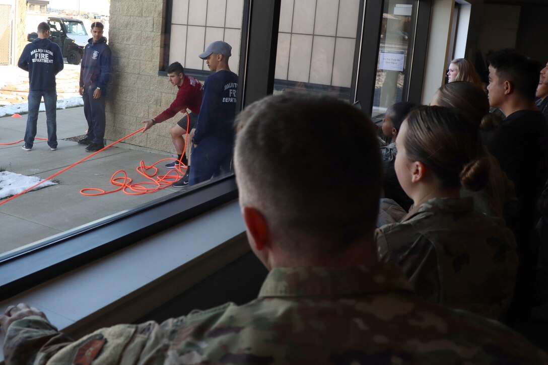 The competition had Airmen of various units perform simulated tasks that firefighters would in the event of a fire.
