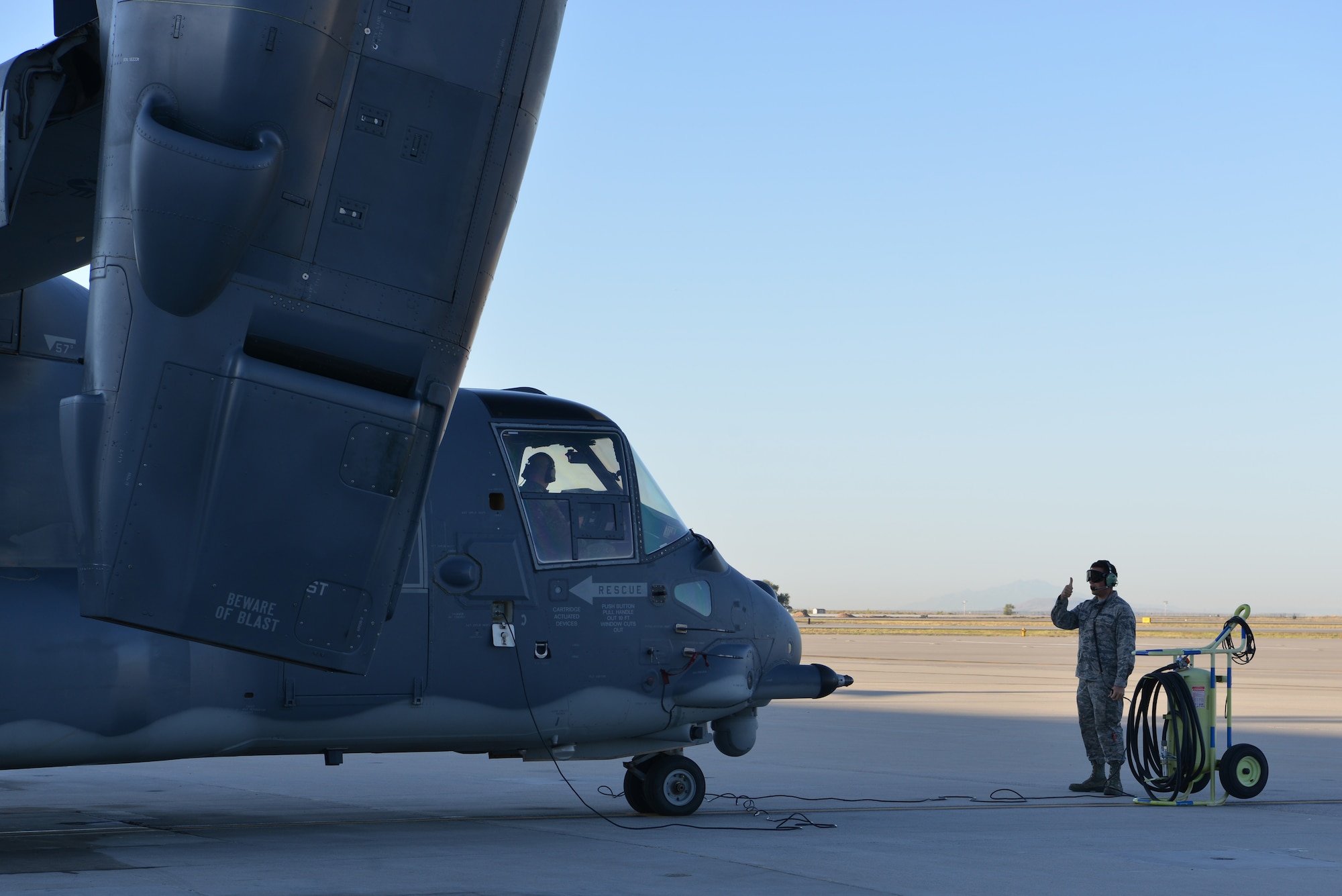 U.S. Air Force Airman 1st Class Ethan McCausland, 71st Aircraft Maintenance Unit CV-22 Osprey crew chief, gives the thumbs up during pre-flight checks at Kirtland Air Force Base, N.M., Oct. 7, 2019. The mission of the 71st AMU is to provide mission ready CV-22 Ospreys for the 71st Special Operations Squadron. (U.S. Air Force photo by Staff Sgt. Dylan Nuckolls)