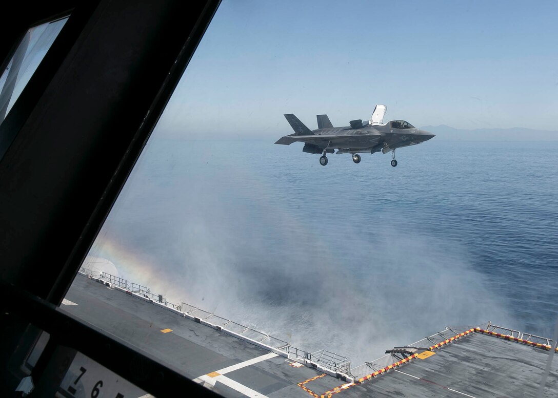 A U.S. Marine Corps F-35B Lightning II with Marine Fighter Attack Squadron (VMFA) 122, Marine Aircraft Group 13, 3rd Marine Aircraft Wing (MAW), prepares to land aboard the amphibious assault ship USS America (LHA 6) in the Eastern Pacific, Oct. 6, 2019. Integrating 3rd MAW’s combat power and capabilities while conducting realistic training is essential to generate readiness and lethality in our units. (U.S. Marine Corps photo by Lance Cpl. Juan Anaya)