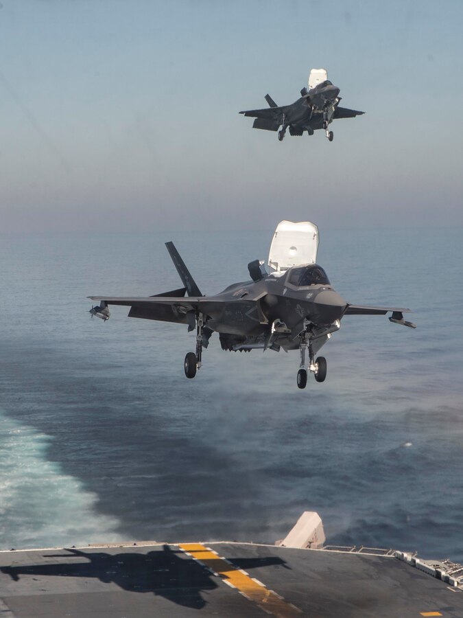U.S. Marine Corps F-35B Lightning IIs with Marine Fighter Attack Squadron (VMFA) 122, Marine Aircraft Group (MAG) 13, 3rd Marine Aircraft Wing (MAW), prepare to land aboard the amphibious assault ship USS America (LHA 6) in the eastern Pacific, Oct. 6, 2019. Integrating 3rd MAW’s combat power and capabilities while conducting realistic training is essential to generate readiness and lethality in our units. (U.S. Marine Corps photo by Sgt. Charles Plouffe)
