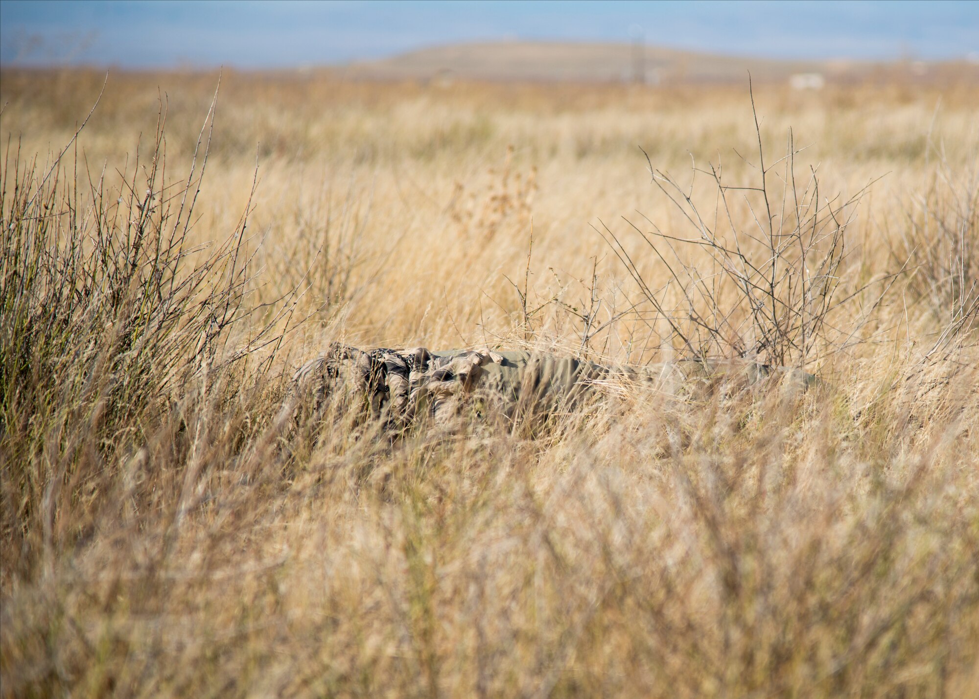 Tech Sgt. Timothy Emkey, 366th Fighter Wing survival, evasion, resistance and escape specialist, explains what to look for when trying to evade the enemy's line of sight Sept. 26, 2019, at Saylor Creek Bombing Range, Idaho.