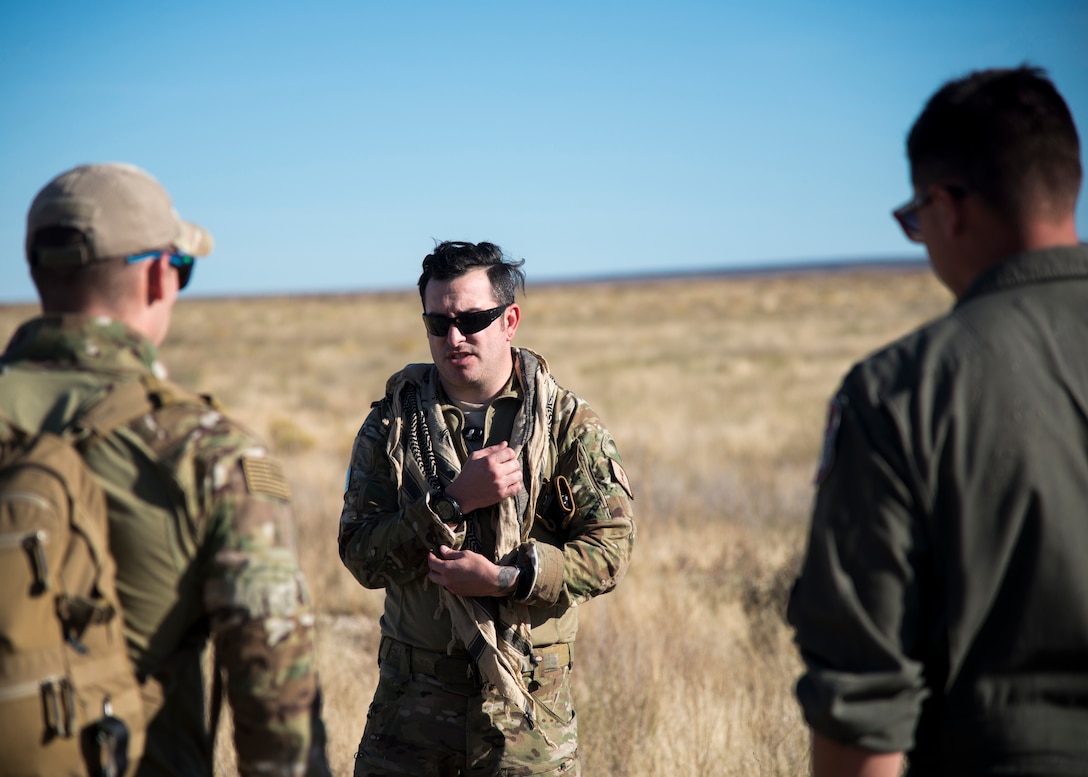 Tech Sgt. Timothy Emkey, 366th Fighter Wing survival, evasion, resistance and escape specialist, explains what to look for when trying to evade the enemy's line of sight Sept. 26, 2019, at Saylor Creek Bombing Range, Idaho.