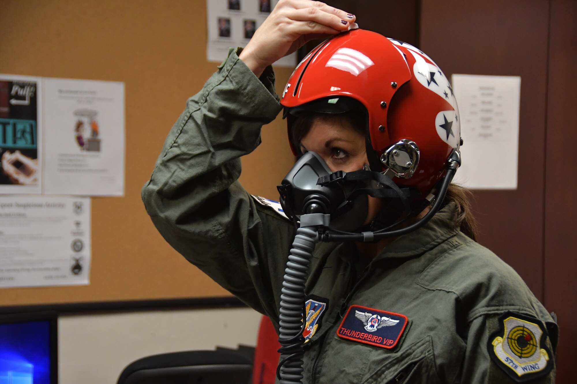 Tracey Pendley, an Atlanta Public Schools fourth grade teacher, adjusts the visor on her helmet at Dobbins Air Reserve Base, Ga. on Oct. 11, 2019. In addition to being named Georgia’s Teacher of the Year, she was also nominated as a Hometown Hero, a program which allows exceptional community members to be nominated for a familiarization flight in a Thunderbirds jet, an F-16 Fighting Falcon.  (U.S. Air Force photo/Airman Kendra A. Ransum)