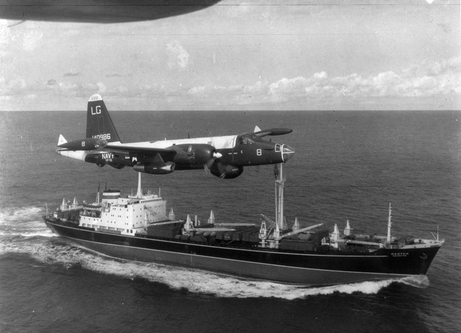 A U.S. Navy P2V Neptune flies over a Soviet freighter Oct. 27, 1962, during the height of the blockade during the Cuban Missile Crisis. National Archives and Records Administration photo