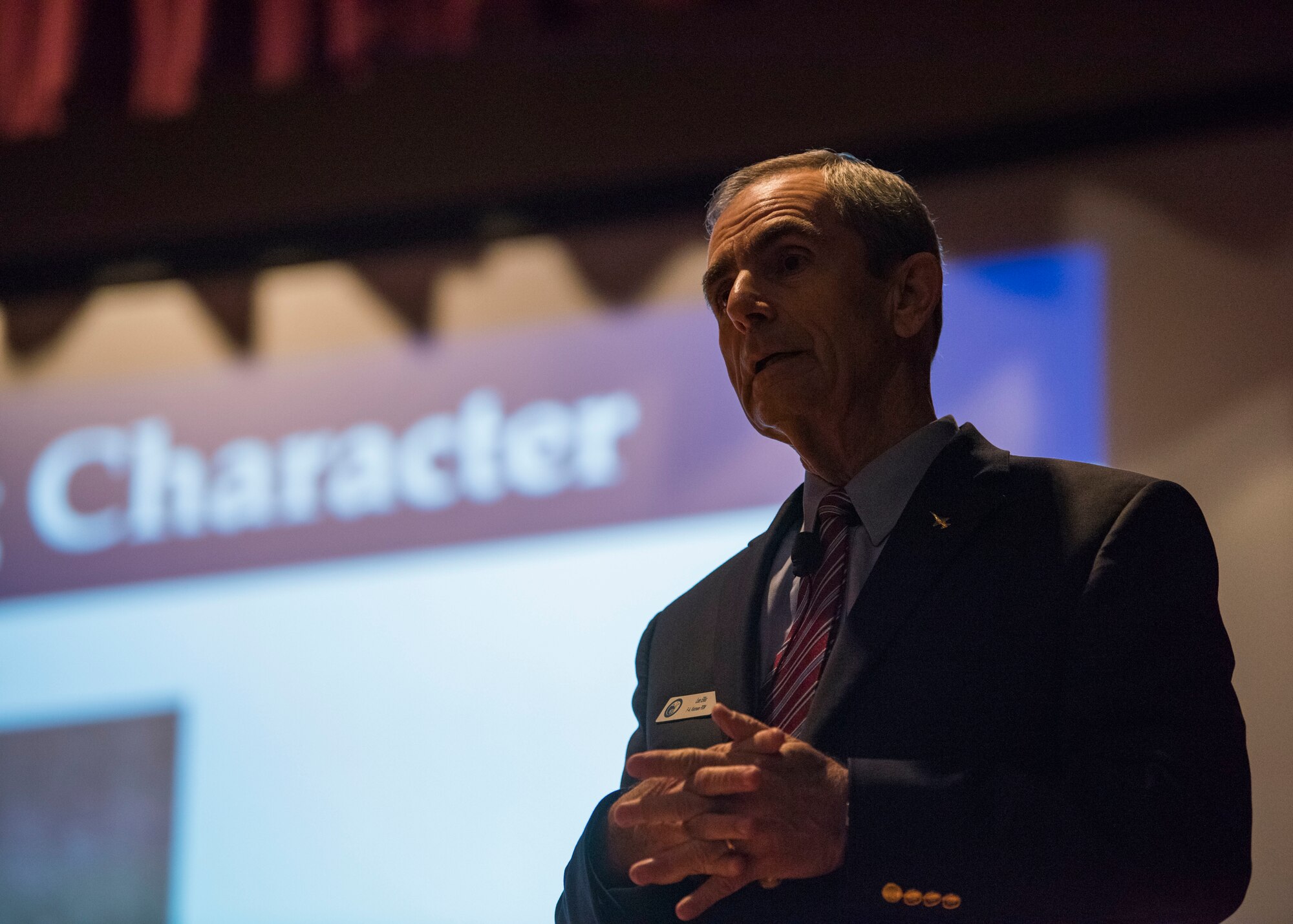 Retired Col. Lee Ellis, Vietnam War F-4 Phantom pilot and author of “Leading with Honor,” shares his experiences as a prisoner of war during the Vietnam War with members of Team Fairchild as part of a monthly Fairchild Speaker Series in the base theater at Fairchild Air Force Base, Washington, Oct. 8, 2019. The Fairchild Speaker Series is a monthly event where experts and leaders from diverse career fields come to share leadership insights with Team Fairchild and provide Airmen the opportunity to expand their professional development in preparation for the potential challenges of today and tomorrow. (U.S. Air Force photo by Airman 1st Class Lawrence Sena)