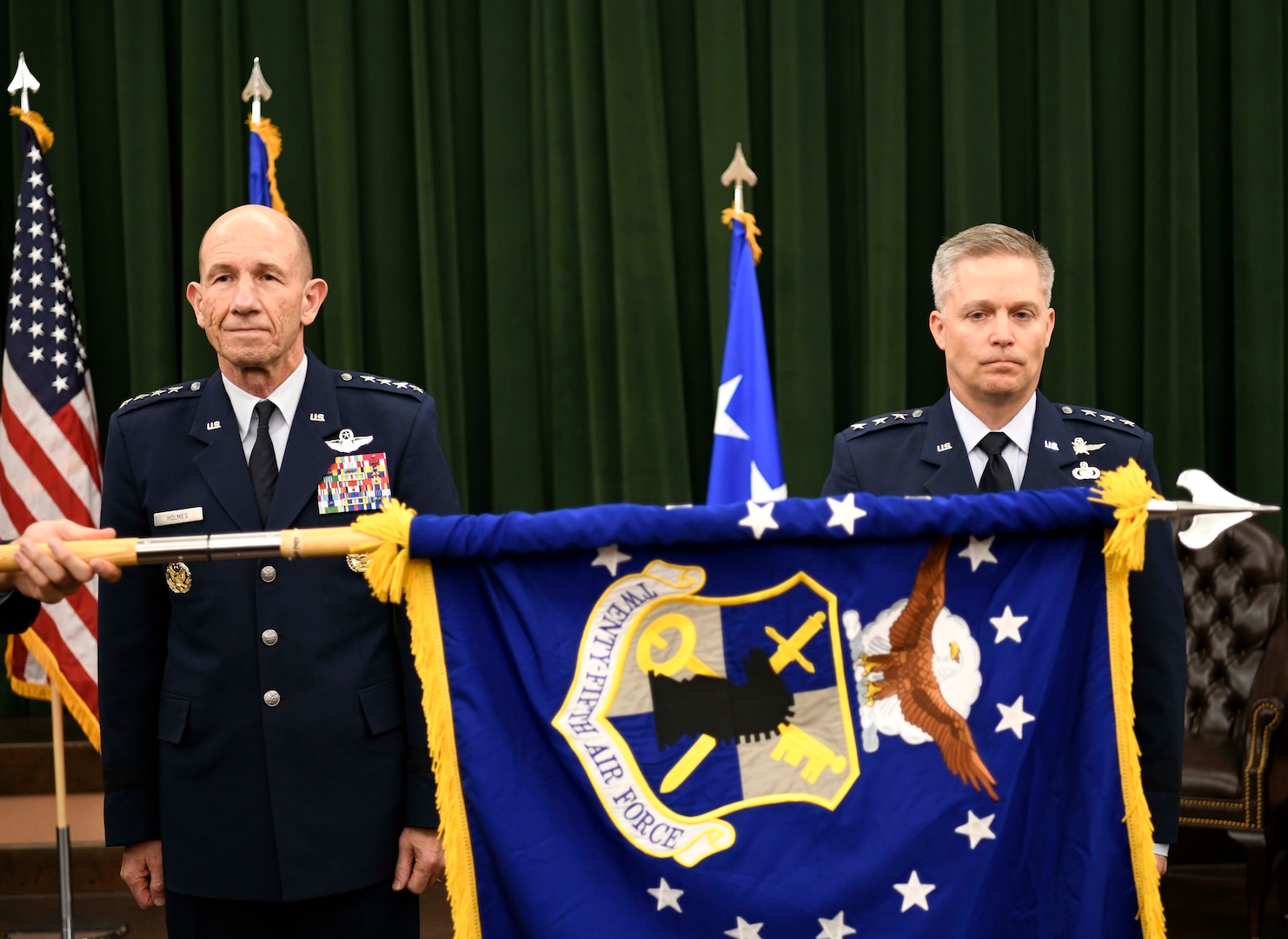 The Twenty-Fifth Air Force flag is furled to signify its inactivation, as Gen. Mike Holmes, Air Combat Command commander, and Lt. Gen. Timothy Haugh, Twenty-Fifth Air Force commander, look on during the Sixteenth Air Force assumption of command at Joint Base San Antonio-Lackland, Texas, Oct. 11, 2019. The Twenty-Fourth Air Force was also inactivated during the ceremony to integrate into the new information warfare numbered air force. Sixteenth Air Force is responsible for providing information warfare capabilities to combatant commanders with the speed to match today’s technological environment.
