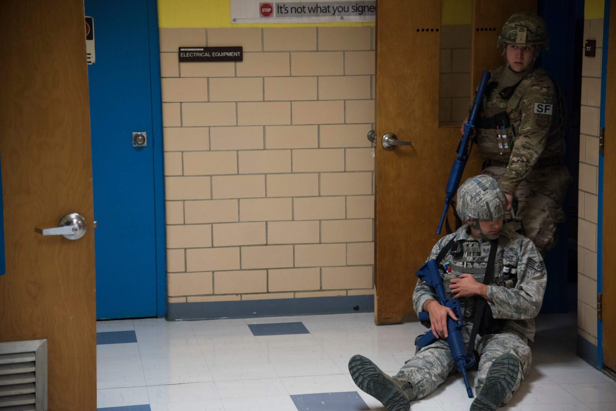 Staff Sgt. Harold Snyder, 436th Security Forces Squadron flight sergeant, drags Staff Sgt. Keylan Moore, 436th SFS response force leader, into a room Oct. 11, 2019, at Dover Air Force Base, Del. Moore was one of two “casualties” during the active shooter exercise. (US Air Force Photo by A1C Jonathan Harding)