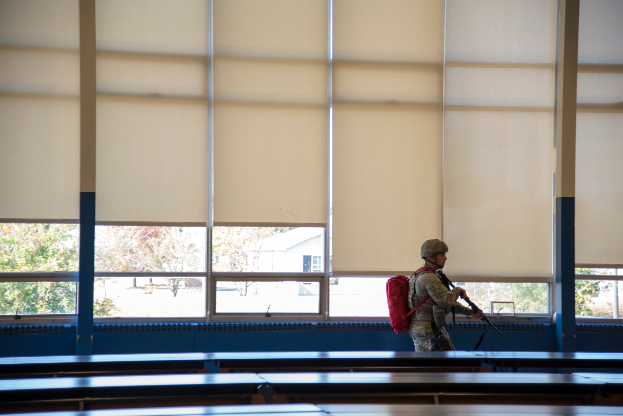 Staff Sgt. Tim Endres, 436th Security Forces Squadron response force leader, clears a cafeteria Oct. 11, 2019, at Dover Air Force Base, Del. Once inside a room, security forces Airmen searched for potential occupants and casualties. (U.S. Air Force photo by Airman 1st Class Jonathan Harding)