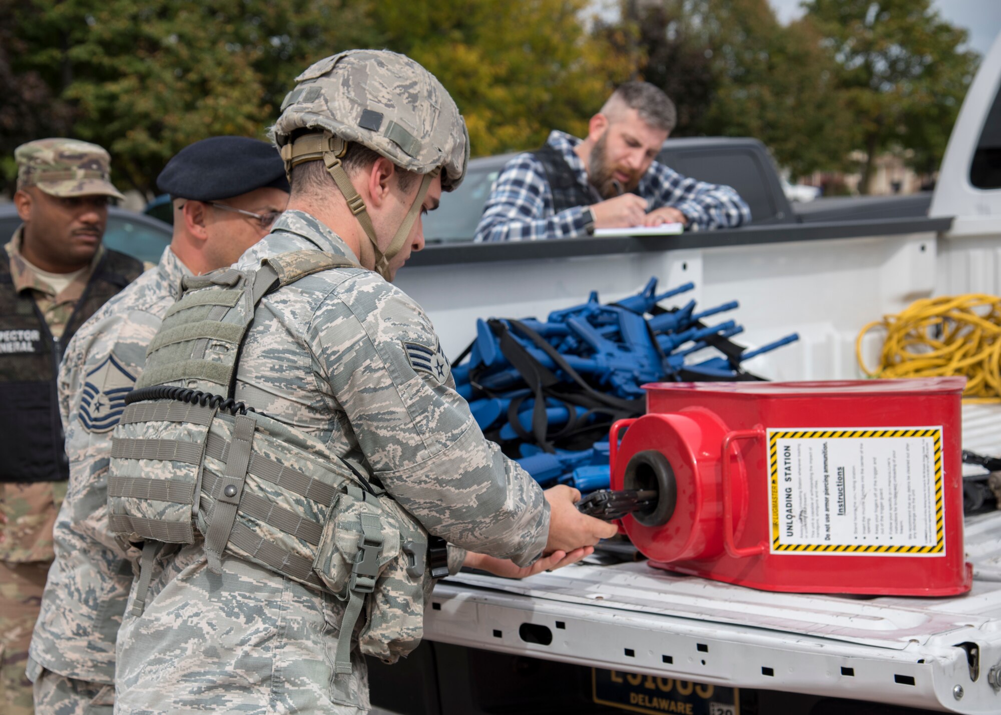 Senior Airman Miguel Bettencourt, 436th Security Forces Squadron response member, clears his handgun prior to an exercise Oct. 11, 2019, at Dover Air Force Base, Del. Exercise players exchanged their weapons for dummy models to prevent potential injury. (U.S. Air Force photo by Airman 1st Class Jonathan Harding)