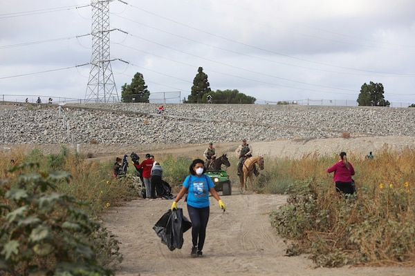 Volunteers pick up trash and debris during a Sept. 28 clean-up event at the Whittier Narrows Dam Nature Center in South El Monte, California. The U.S. Army Corps of Engineers Los Angeles District, along with Los Angeles County and the Whittier Narrows Nature Center Associates hosted the event as part of National Public Lands Day.