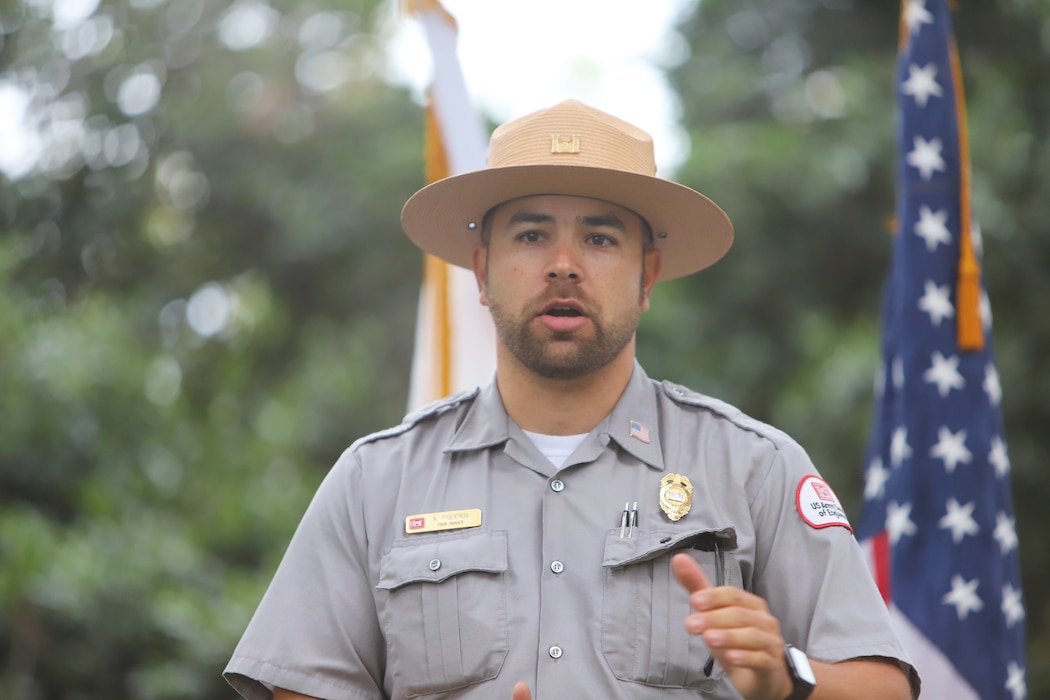 U.S. Army Corps of Engineers Los Angeles District Park Ranger Nick Figueroa greets volunteers before providing them with a safety brief at a clean-up event during National Public Lands Day Sept. 28 at Whittier Narrows Nature Center in South El Monte, California. More than 100 volunteers picked up trash and debris along a stretch of the riverbed from the nature center to the Whittier Narrows Dam's San Gabriel spillway. The debris consisted of shoes, shredded clothing, shopping carts, tires, plastic bottles and miscellaneous trash, totaling about 6,500 pounds.