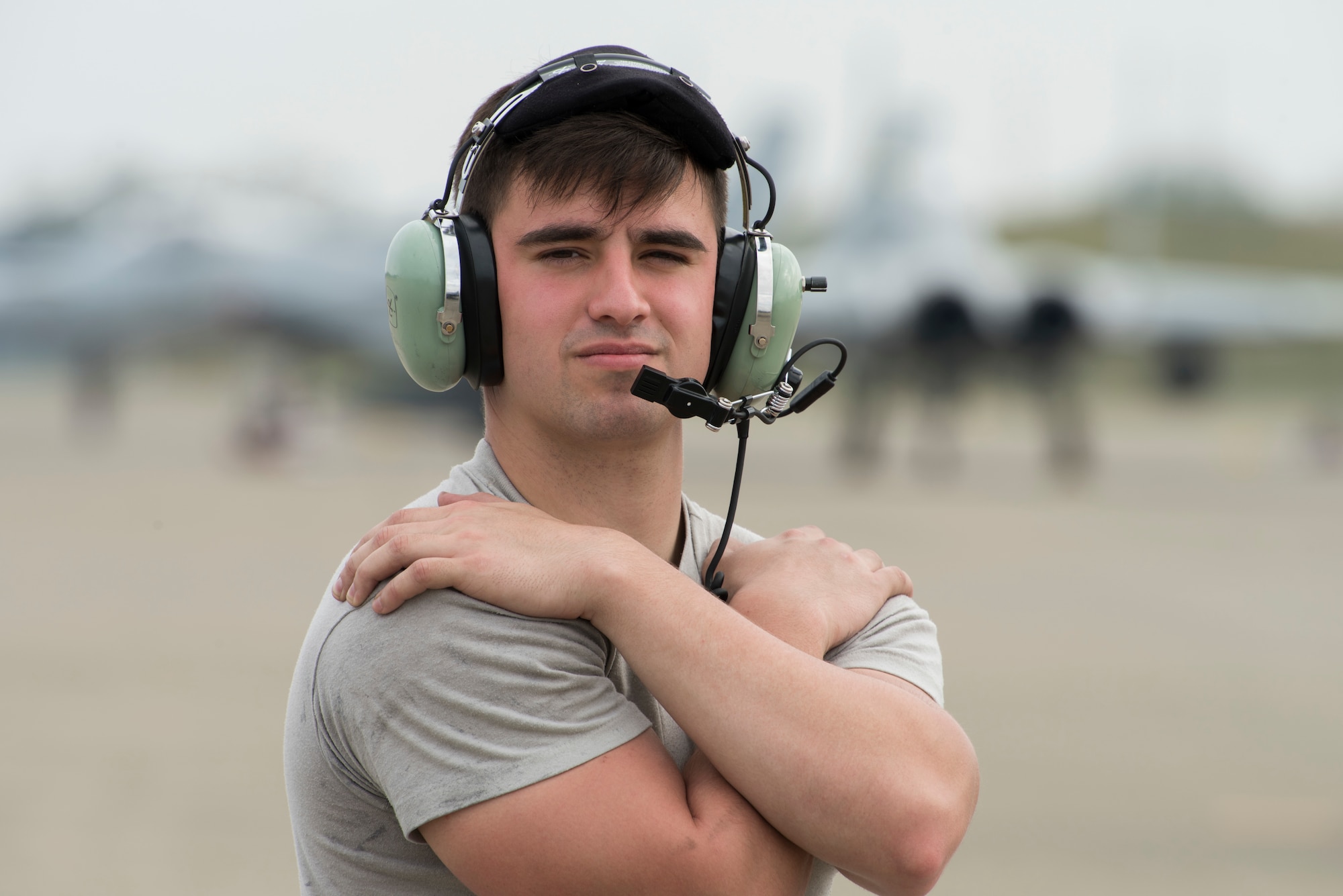 U.S. Air Force Senior Airman Taylor Simmons, a 35th Maintenance Squadron lead inspector section team member, marshalls an F-16 Fighting Falcon during an aviation training relocation at Komatsu Air Base, Japan, Oct. 2, 2019. Misawa Airmen paired with Japan Air Self-Defense Force members during the launch and recovery of jets to increase their knowledge of receiving and sending off F-16s properly and efficiently during the bilateral training. Simmons and the 35th MXS are assigned to Misawa AB, Japan. (U.S. Air Force photo by Senior Airman Collette Brooks)