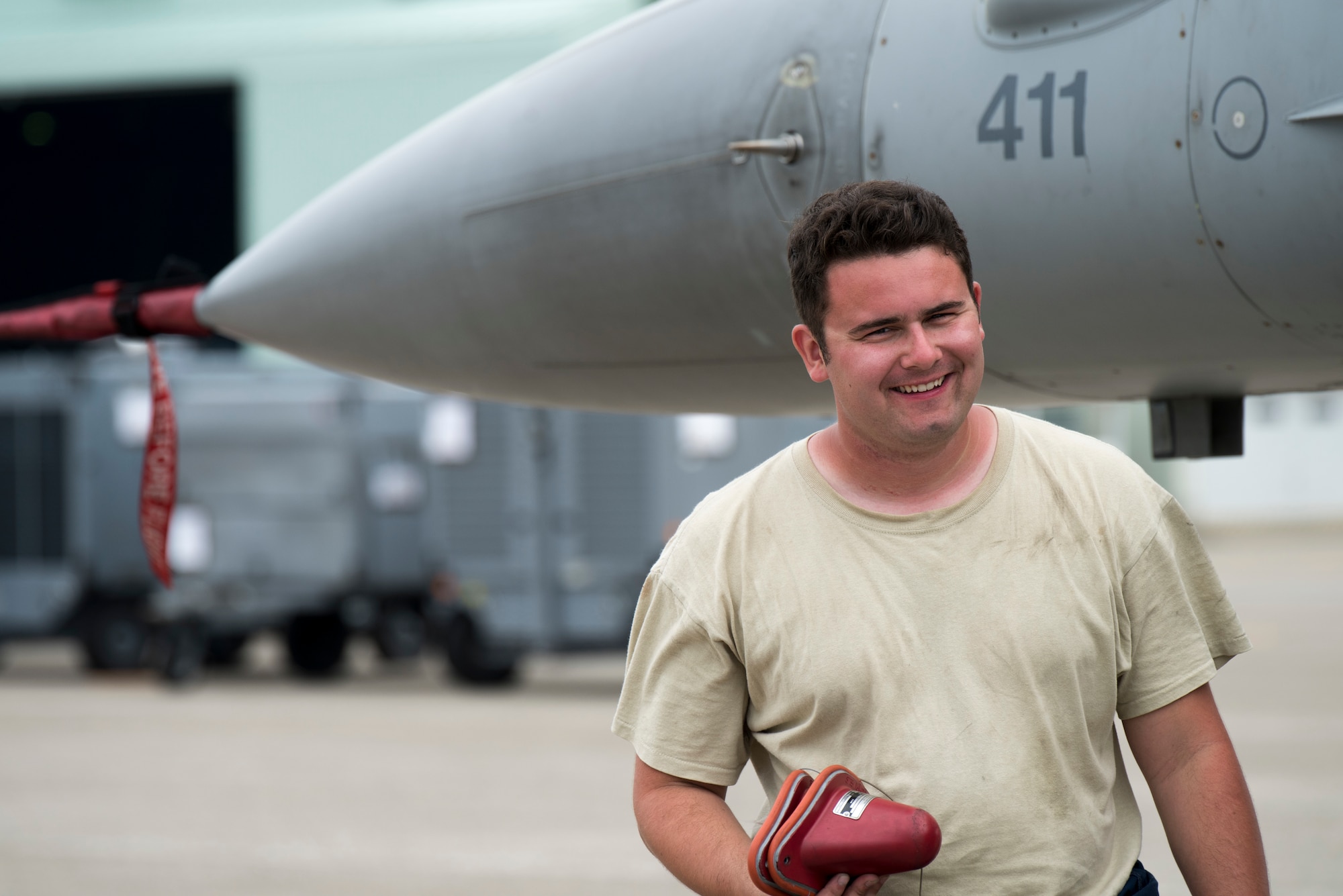 U.S. Air Force Airman 1st Class Devlin Hamsher, a 13th Aircraft Maintenance Unit crew chief, holds angle of attack sensor covers during an aviation training relocation at Komatsu Air Base, Japan, Oct. 2, 2019. Airmen relocated from Misawa AB to Komatsu AB enhancing their communication skills, training abilities and bilateral relations with host nation members. Hamsher and the 13th AMU are assigned to Misawa AB, Japan.  (U.S. Air Force photo by Senior Airman Collette Brooks)