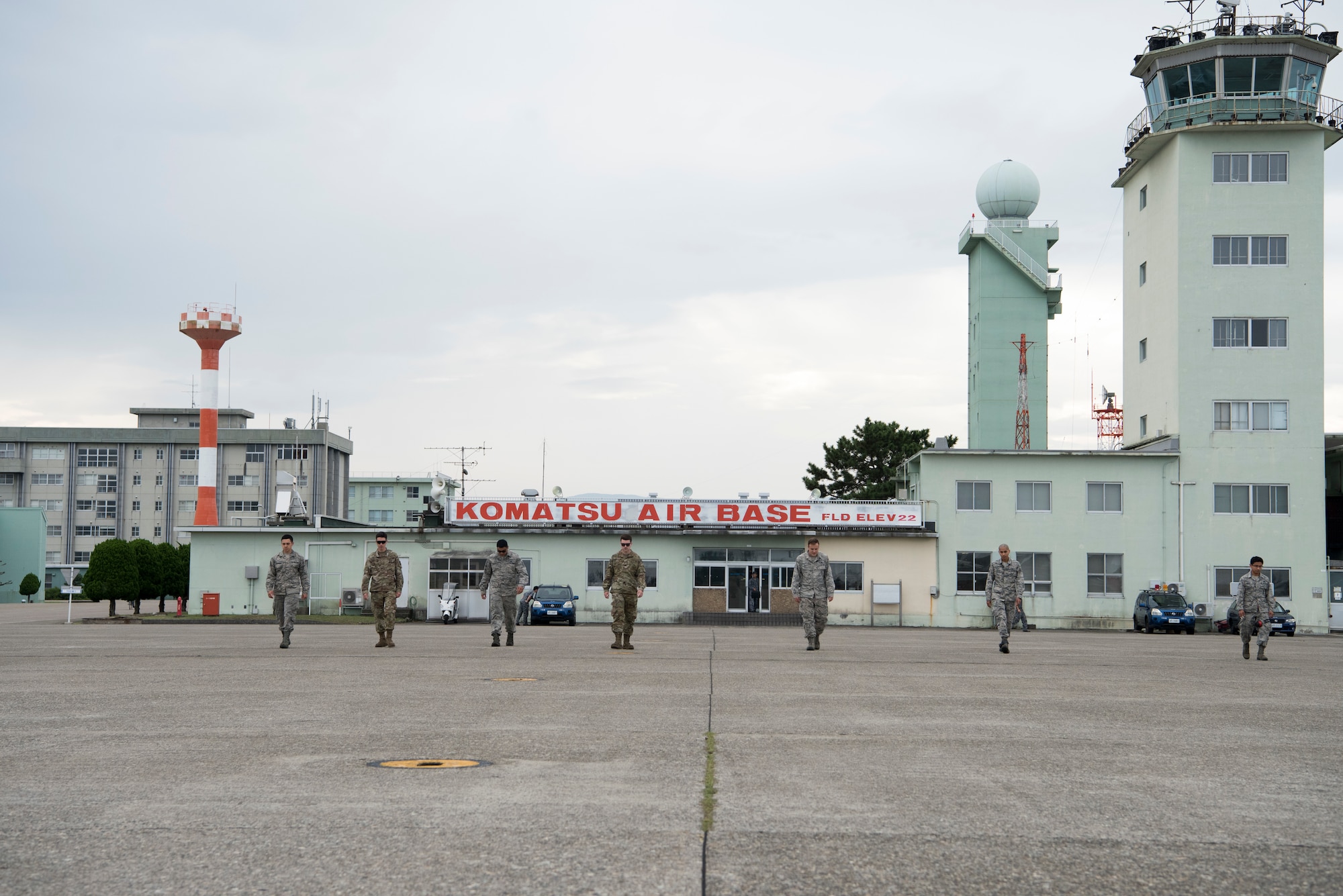 Airmen with the 13th Aircraft Maintenance Unit perform a foreign object and debris inspection on the flight line during an aviation training relocation at Komatsu Air Base, Japan, Oct. 3, 2019. Approximately 15 35th Fighter Wing Airmen traveled up and down the Komatsu runway to locate and remove any debris items, such as bolts, screws, rocks or plastic, to ensure the safety of the aircrafts participating in the bilateral training exercise. The 35th Fighter Wing is assigned to Misawa AB, Japan. (U.S. Air Force photo by Senior Airman Collette Brooks)