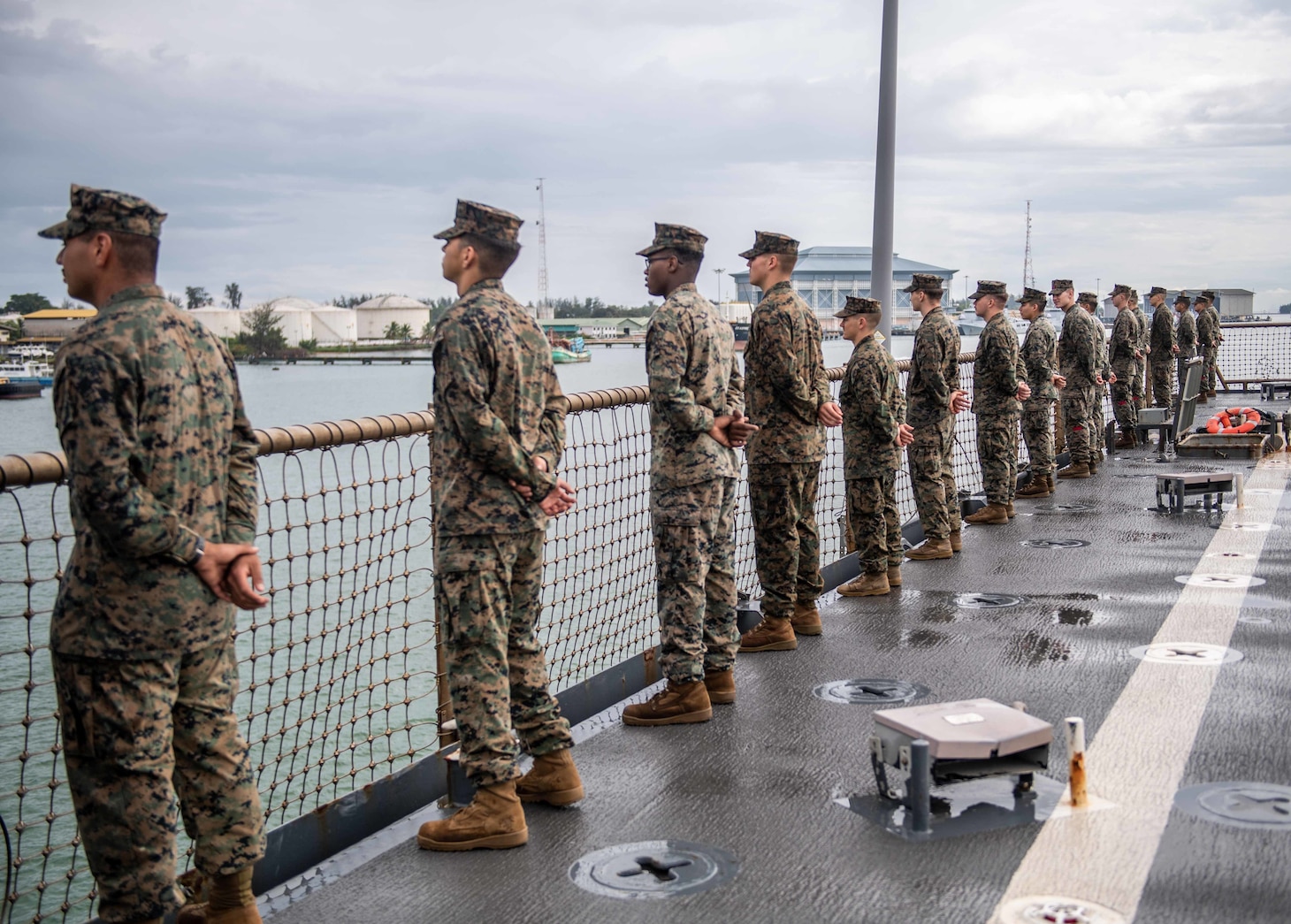 MAURA, Brunei (Oct. 10, 2019) Marines, assigned to the 11th Marine Expeditionary Unit (MEU), man the rails of the amphibious dock landing ship USS Harpers Ferry (LSD 49) as the ship arrives in Maura, Brunei, for Cooperation Afloat Readiness and Training (CARAT) Brunei. Harpers Ferry and elements of the 11th MEU are ashore in Brunei to perform day and night training in an urban environment and to enhance interoperability and partnership between the U.S. and Brunei during CARAT Brunei 2019.