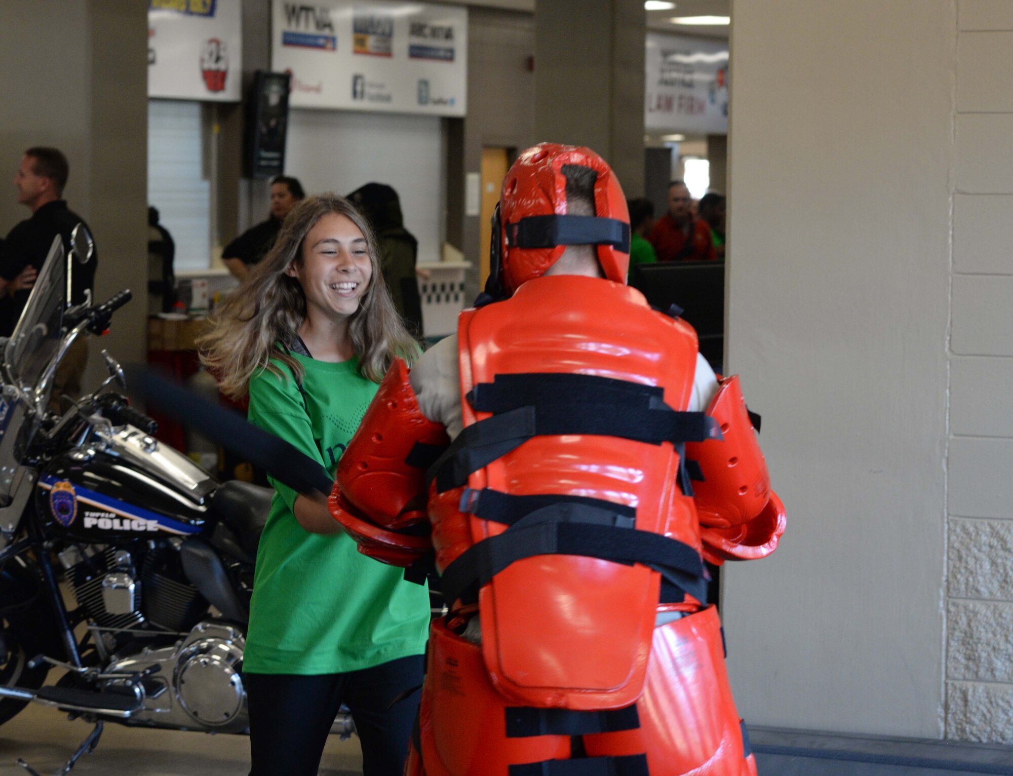Airman 1st Class Kyle Frias, 14th Security Forces Squadron specialist, teaches a student combatives during the Imagine the Possibilities Career Expo Oct. 1, 2019, at the BancorpSouth Arena in Tupelo. The 14th SFS also displayed various weapons they use in combat at their station. The expo was from Oct. 1-3 and had more than 7,200 eighth grade students from schools throughout 17 northeast Mississippi counties attend. (U.S. Air Force photo by Airman Davis Donaldson)