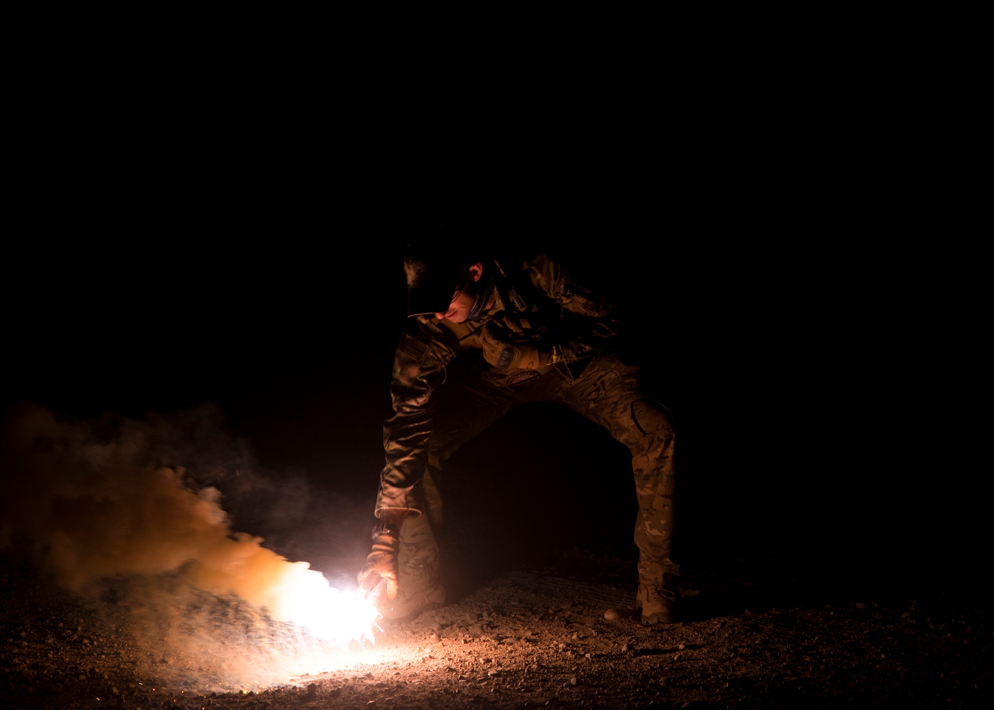 Staff Sgt. David Chorpeninng, 366th Fighter Wing survival, evasion, resistance and escape specialist, pops the illumination end of a MK-124 marine smoke and illumination signal Sept. 26, 2019, at Saylor Creek Bombing Range, Idaho.