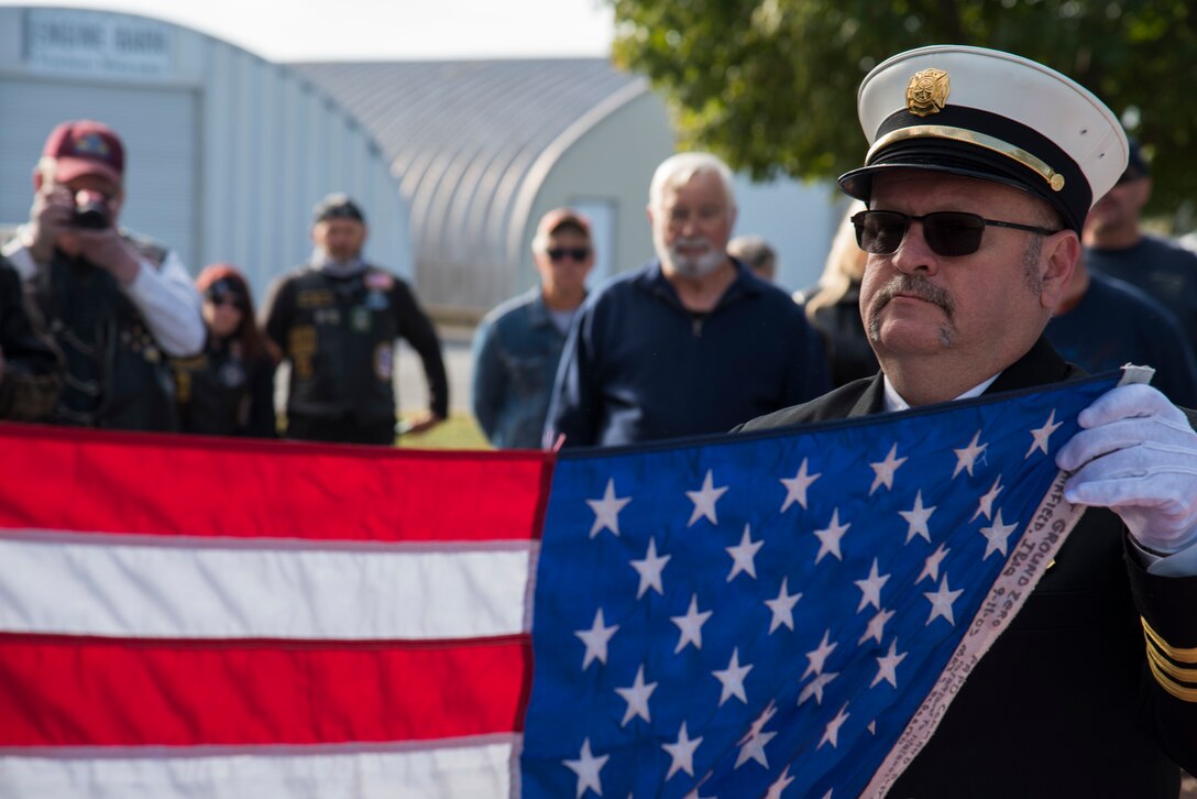 Onlookers watch as the Ground Zero flag is folded Oct. 12, 2019, at Dover Air Force Base, Del. The Ground Zero Flag Team’s goals include remembering 9/11 victims and survivors, paying tribute to the military, honoring first responders who serve their communities and assuring their families we will never forget the sacrifices their loved ones have made. (U.S. Air Force photo by Airman 1st Class Jonathan Harding)