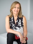 A photo of a seated woman, author Liza Mundy, CCH Scholar-in-Residence for 2020.