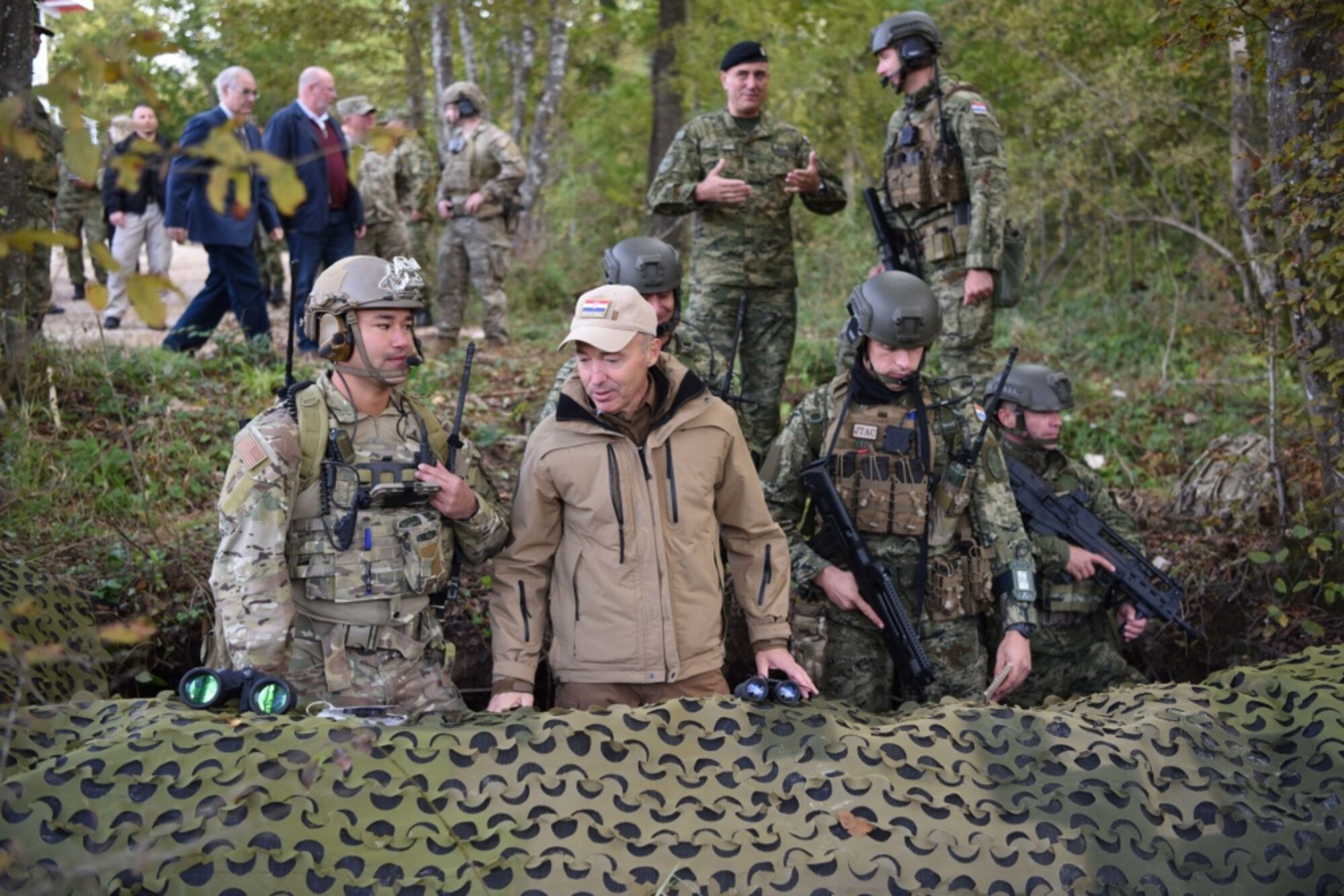 Damir Krsticevic, Croatian minister of defense, stands in a trench with U.S. and Croatian joint terminal attack controllers during a grand opening of a range observation tower ceremony at Slunj Training Area, Croatia, October 4, 2019. After the official ceremony concluded, U.S. and Croatian joint terminal attack controllers, F-16’s from Aviano AB, Italy, and Croatian OH-58 helicopters participated in a joint demonstration. (U.S. photo by Senior Airman Milton Hamilton