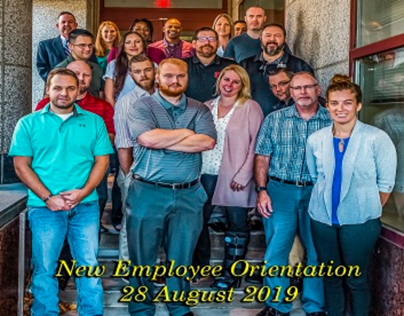 New associates pose for a group photo after attending New Employee Orientation Aug. 28 and 29 in the Building 20 Buckeye Room. The class included police officers, quality assurance specialist and staff accounts. Pictured (l-r) Matthew Archer, Louis Shotto, Kelly Lincoln, Robert Dotson, Rachael Davis.  2nd Row Kevin Houser, Robert Rickel.  3rd Row Todd Lott, Sherry Lott, Jerry Caylor, Jared Koscis. Back Row Griff Warren, Kristen Hershberger, Stephanie Avery, Harry White, Pam Carrico, Angel Martinez, Kevin Bellew and Arron Reeves.