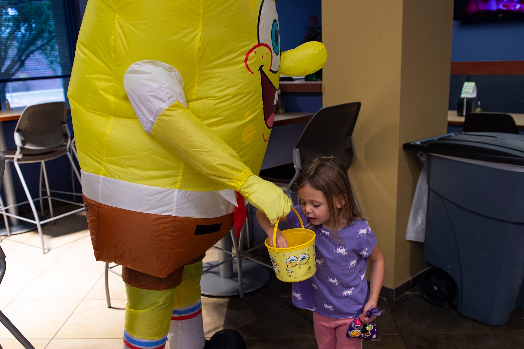 A participant reaches into a bucket of candy during a Deployed Spouses Dinner Oct. 15, 2019, at Moody Air Force Base, Ga. The monthly event is a free dinner at Georgia Pines Dining Facility designed as a ‘thank you’ for each family’s support and sacrifice. The dinner, occurring on every third Tuesday of the month, provides an opportunity for spouses to interact with other families of deployed Airmen, key spouses and unit leadership as well as provide a break for the spouse while their military sponsor is deployed. The next Deployed Spouses Dinner will be Nov. 19. (U.S. Air Force photo by Airman Azaria E. Foster)