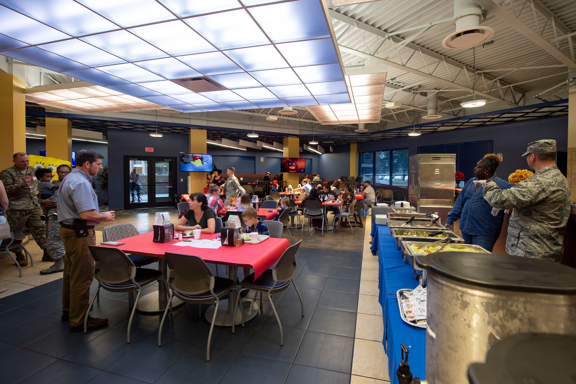 Participants socialize during a Deployed Spouses Dinner Oct. 15, 2019, at Moody Air Force Base, Ga. The monthly event is a free dinner at Georgia Pines Dining Facility designed as a ‘thank you’ for each family’s support and sacrifice. The dinner, occurring on every third Tuesday of the month, provides an opportunity for spouses to interact with other families of deployed Airmen, key spouses and unit leadership as well as provide a break for the spouse while their military sponsor is deployed. The next Deployed Spouses Dinner will be Nov. 19. (U.S. Air Force photo by Airman Azaria E. Foster)