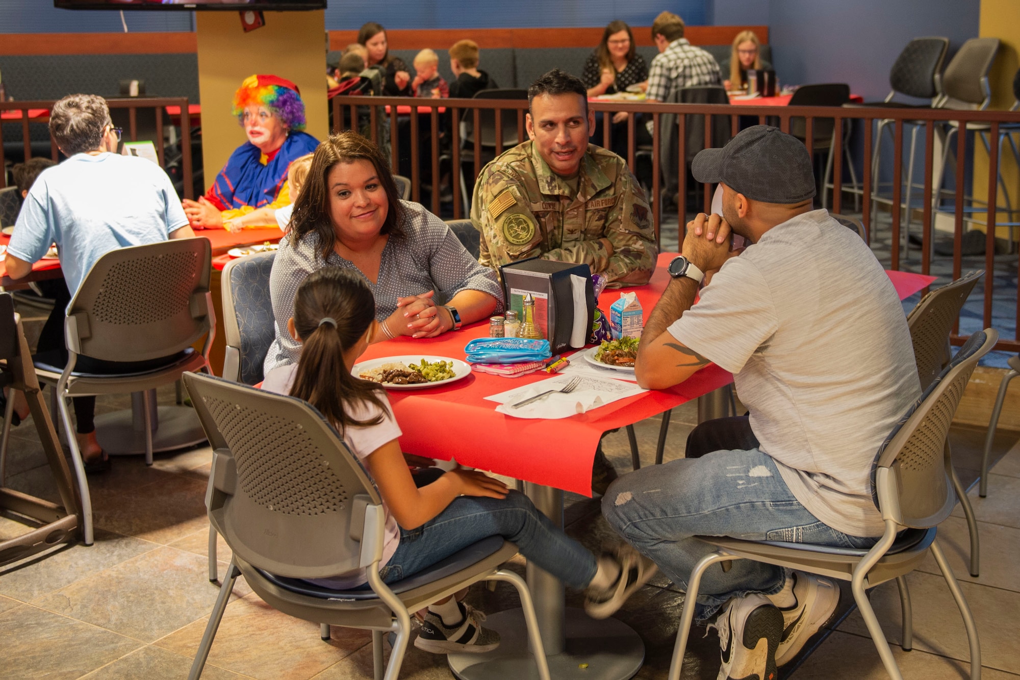 Col. Benjamin Conde, center, 23d Wing vice commander, and his spouse socialize with participants during a Deployed Spouses Dinner Oct. 15, 2019, at Moody Air Force Base, Ga. The monthly event is a free dinner at Georgia Pines Dining Facility designed as a ‘thank you’ for each family’s support and sacrifice. The dinner, occurring on every third Tuesday of the month, provides an opportunity for spouses to interact with other families of deployed Airmen, key spouses and unit leadership as well as provide a break for the spouse while their military sponsor is deployed. The next Deployed Spouses Dinner will be Nov. 19. (U.S. Air Force photo by Airman Azaria E. Foster)