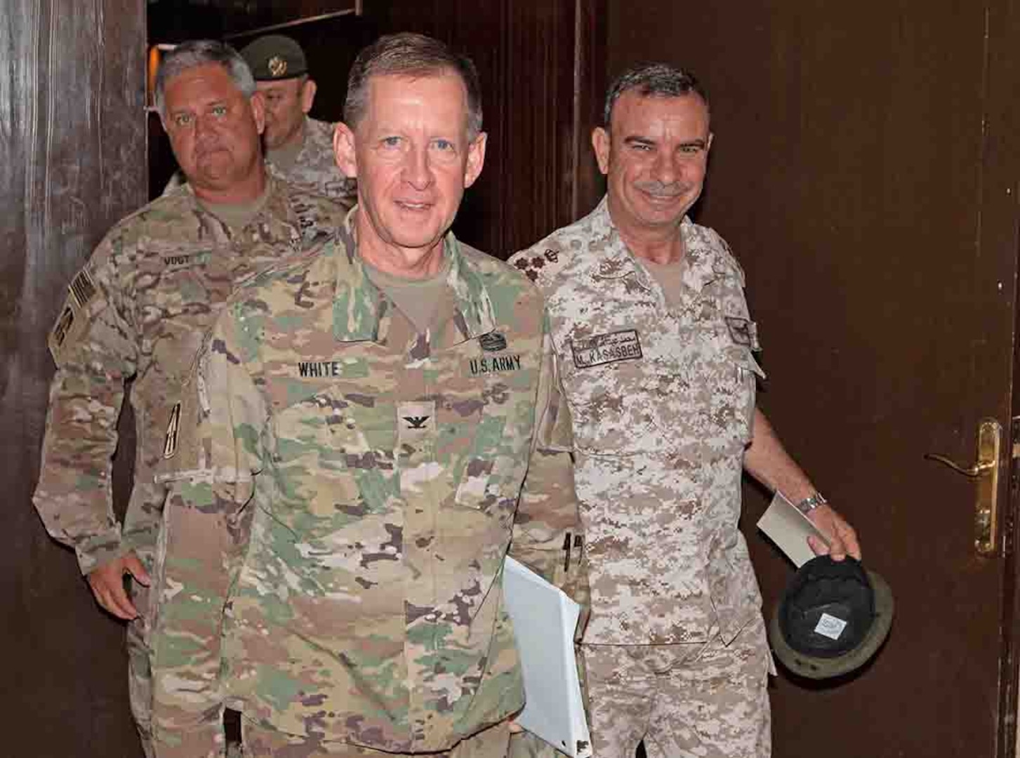 U.S. Army Col. Kirk White (center), senior Army leader of Jordan, walks with Jordan Armed Forces Brig. Gen. Khalid Al-Masaeid (right), Northern region commander, after the closing ceremony for a Jordan Operational Engagement Program (JOEP) training cycle between New Jersey National Guard Soldiers, with 1st Squadron, 102nd Calvary Regiment, 44th Infantry Brigade Combat Team of the 42nd Infantry Division, and Jordan Border Guard Force Soldiers, with the 7th Mechanized Battalion, 48th Mechanized Brigade, at Joint Training Center-Jordan Oct. 3, 2019.
