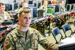 Capt. Matthew Jones, a military intelligence officer with the 157th Maneuver Enhancement Brigade, during a recent Warfighter Exercise at Fort Campbell, Ky. Jones and the rest of the 157th Maneuver Enhancement Brigade headquarters coordinated security, logistics, protection and artillery for the 101st Airborne Division during the two-week exercise.