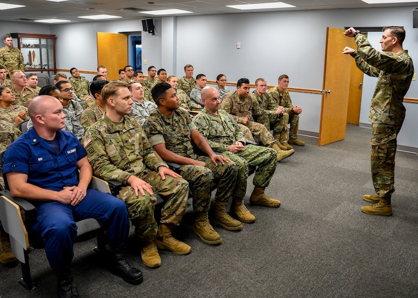 U.S. Air Force Master Sgt. Jeremy Hill, 87th Force Support Squadron Kish Airman Leadership School commandant, converses with Class 19-G before a briefing at Kish ALS on Joint Base McGuire-Dix-Lakehurst, New Jersey, Oct. 11, 2019. The class will graduate on Oct. 17, 2019, after completing the five and a half week course that consisted of 192 hours of curriculum.