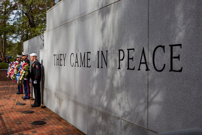 From left to right, U.S. Marine Corps Gunnery Sgt. William L. Koeppe, career planner, Staff Sgt. Nils A. Aylor II, motor vehicle operator, U.S. Navy Hospitalman third class Josh A. Johnson, 8th Marine Regiment, lay wreaths during the 35th Beirut Memorial Observance Ceremony at the Lejeune Memorial Gardens in Jacksonville, N.C., Oct. 23, 2018. A memorial observance is held on Oct. 23 of each year to remember those lives lost during the terrorist attacks at U.S. Marine Barracks, Beirut, Lebanon and Grenada.