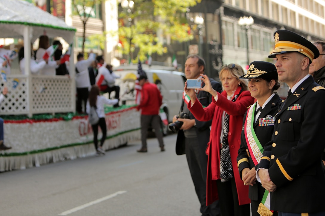 Brig. Gen. Kris A. Belanger, left, Commanding General, 85th U.S. Army Reserve Support Command, and Capt. Michael J. Ariola, Public Affairs Officer, 85th USARSC, both of Italian American heritage, watch a portion of the 67th Annual Columbus Day Parade in the City of Chicago, October 14, 2019.