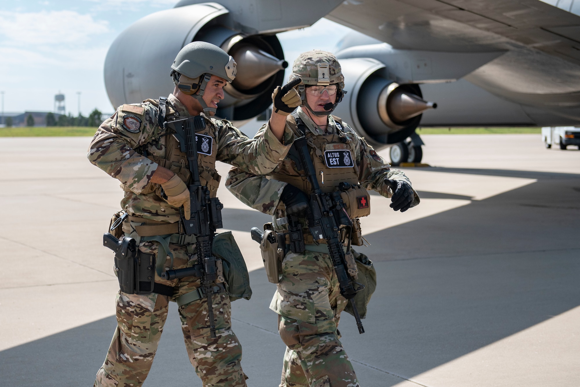 Two defenders assigned to the 97th Security Forces Squadron complete an inspection around a KC-135 Stratotanker after an air defense exercise, October 9, 2019, at Altus Air Force Base, Okla.