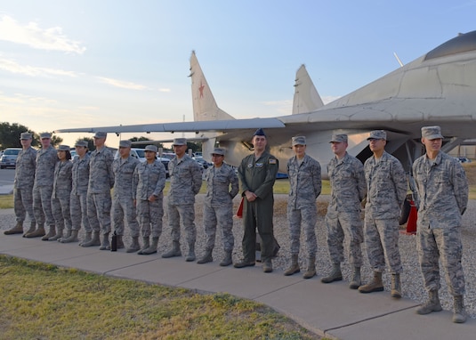 U.S. Air Force Airman 1st Class Noah Sharp, a recent linguist graduate waits with his class to graduate from the Defense Linguist Course at Goodfellow Air Force Base, Texas, Sept. 11, 2019. These skilled professionals have learned to transcribe, translate, and summarize intercepted voice and graphic communications. (U.S. Air Force photo by Airman 1st Class Ethan Sherwood/Released)