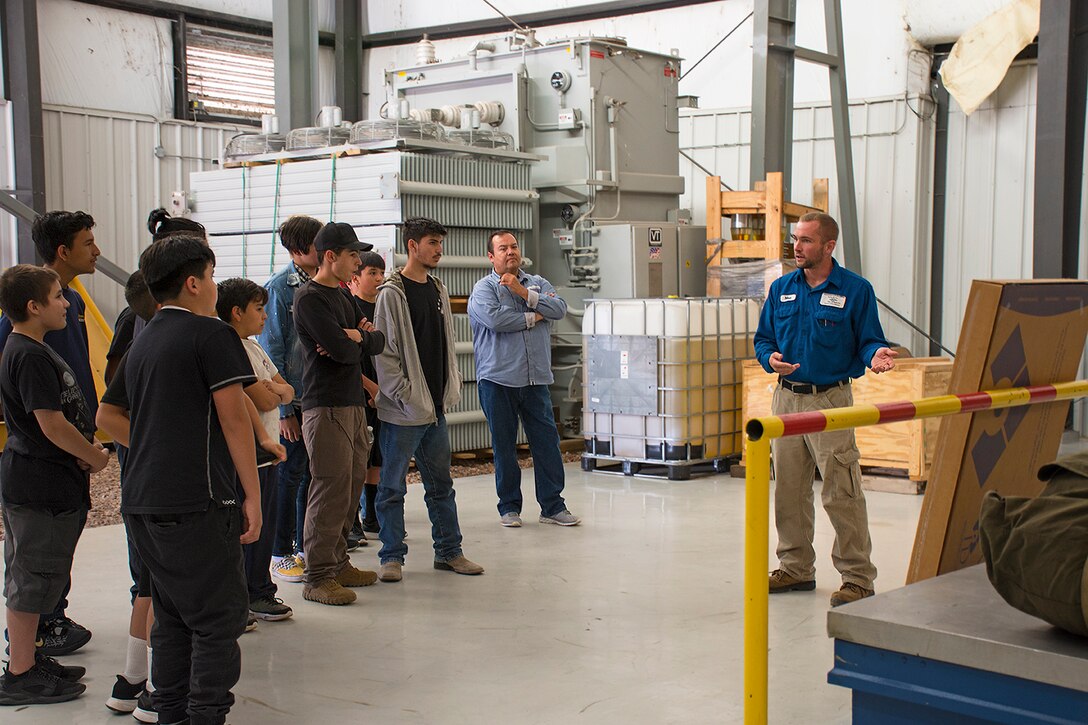 Matthew Weinman, with the Los Alamos Los Alamos Department of Public Utilities, (far right), gives an overview of the hydroelectric facility to students from Coronado High School and Middle School, Oct. 3, 2019.