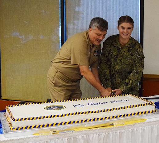 IMAGE: DAHLGREN, Va. (Oct. 16, 2019) – The oldest and youngest Sailors attending the Navy's 244th anniversary celebration cut the birthday cake at Gray's Landing on the Potomac Restaurant. The Navy birthday cake-cutting ceremony is important to all Sailors, as it is an annual renewal of each Sailor's commitment to the Navy and the Navy's commitment to our nation's quest for peace and freedom worldwide. The Sailors cut the cake with a sword, a traditional reminder that they are among a band of warriors, committed to carrying arms so that the United States and its people may live in peace. (U.S. Navy photo by Pamela Berry/Released)