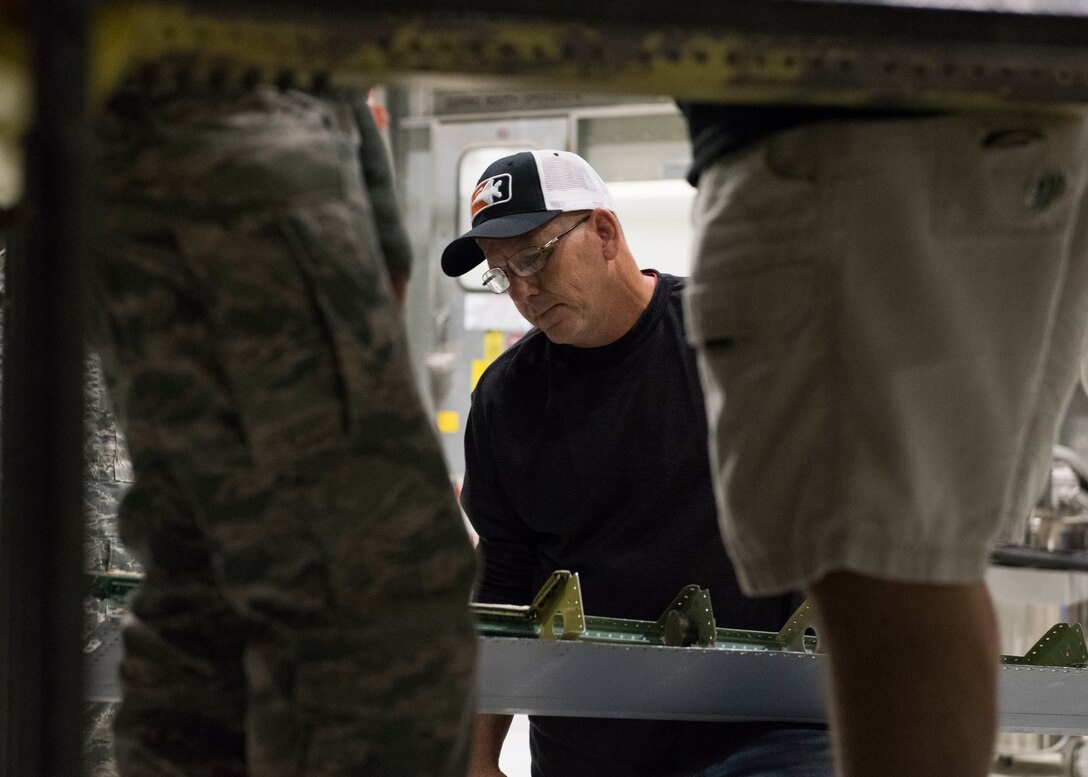 John Swoveland, 402nd Commodities Maintenance Group, aircraft structural mechanic, prepares to attach the leading edge wing of an F-15E Strike Eagle, Oct. 4, 2019, at Mountain Home Air Force Base, Idaho. The leading edge was removed in order to conduct a spar repair on the aircraft. (U.S. Air Force photo by Senior Airman Tyrell Hall)