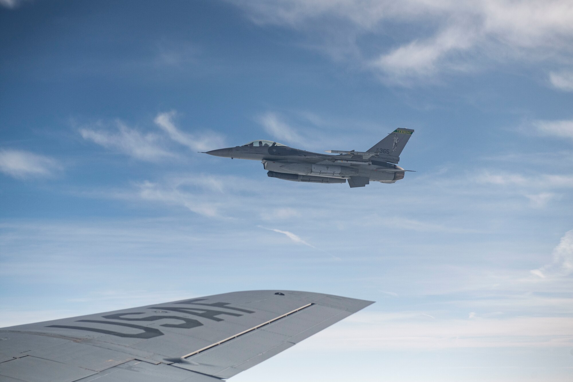 Two F-16 Fighting Falcons fly alongside a KC-135 Stratotanker during an air defense exercise, Oct. 9, 2019, at Altus Air Force Base, Okla.