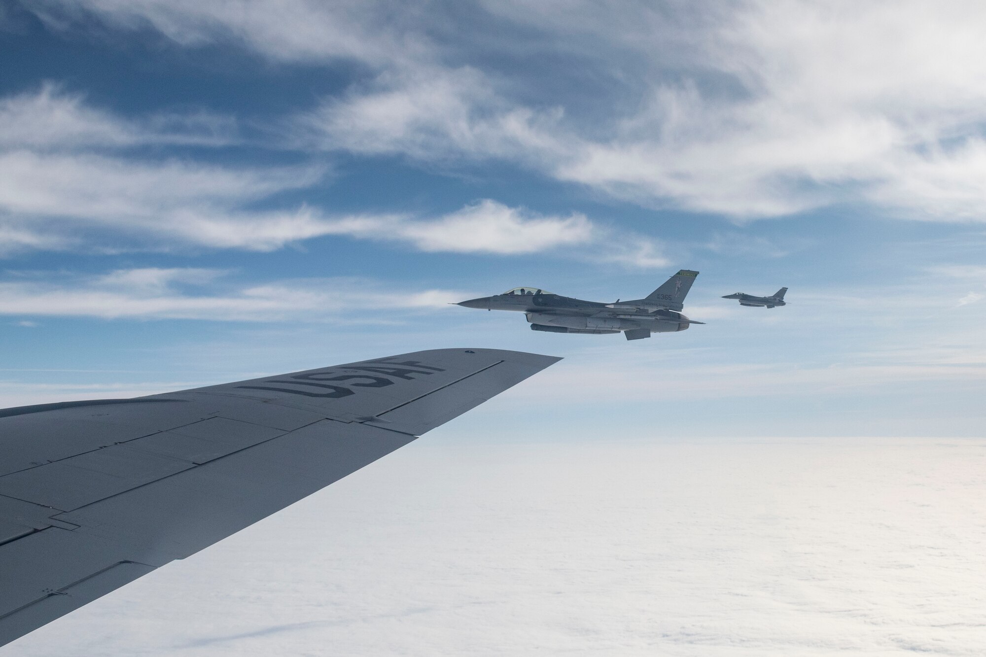 An F-16 Fighting Falcon flies alongside a KC-135 Stratotanker as part of an air defense exercise, October 9, 2019, at Altus Air Force Base, Okla.