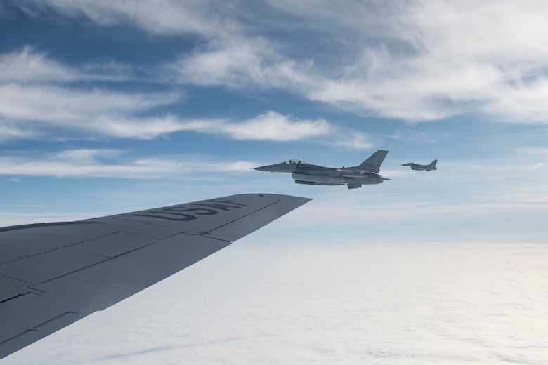 An F-16 Fighting Falcon flies alongside a KC-135 Stratotanker as part of an air defense exercise, October 9, 2019, at Altus Air Force Base, Okla.
