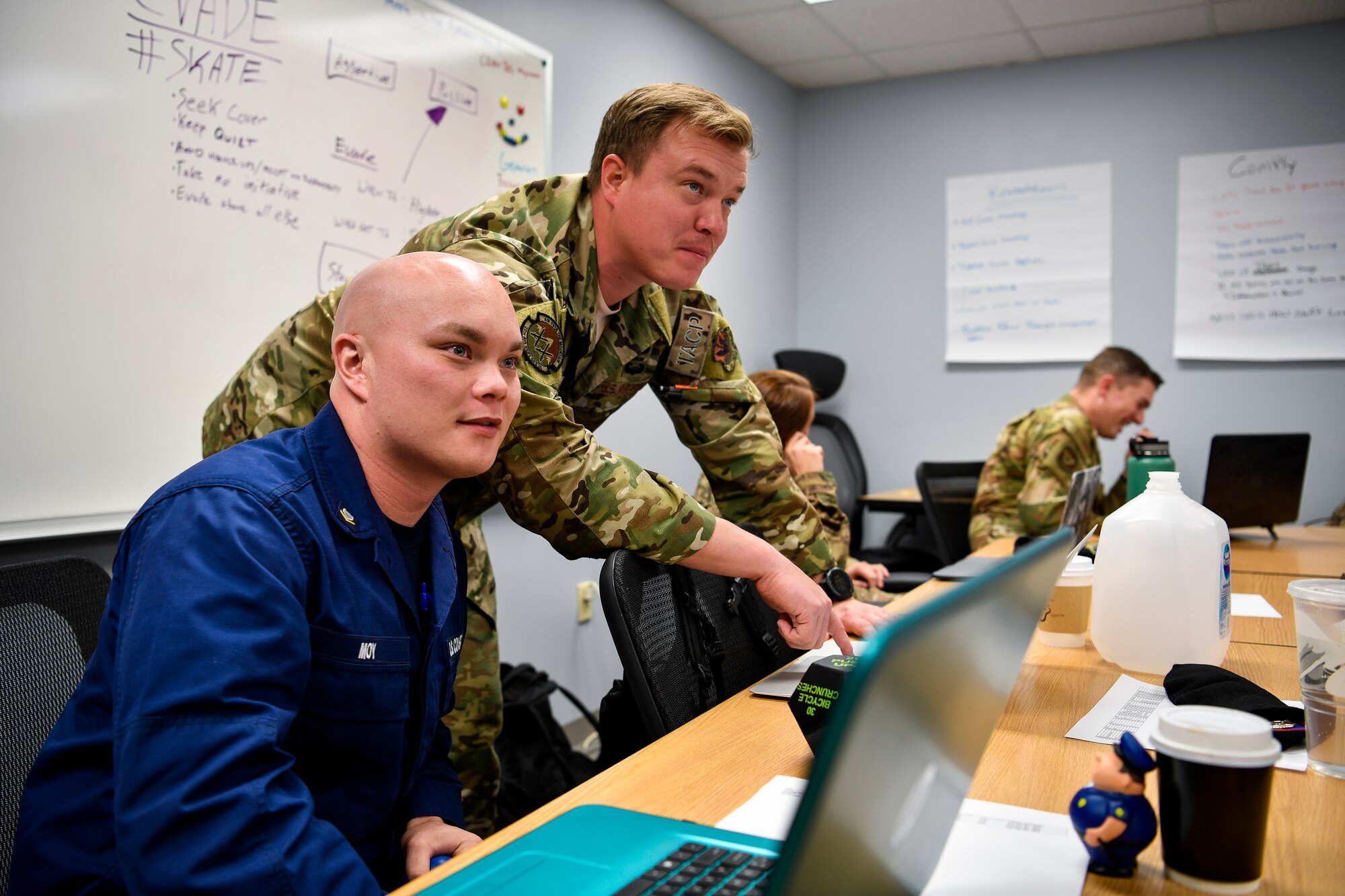 U.S. Coast Guard Petty Officer 3rd Class Brian Moy, USCG Station Atlantic City boatswain’s mate, listens to a Kish Airman Leadership School instructor Oct. 7, 2019, at Kish ALS on Joint Base McGuire-Dix-Lakehurst, New Jersey. During ALS, individuals learn problem solving techniques and how to become leaders to junior service members.