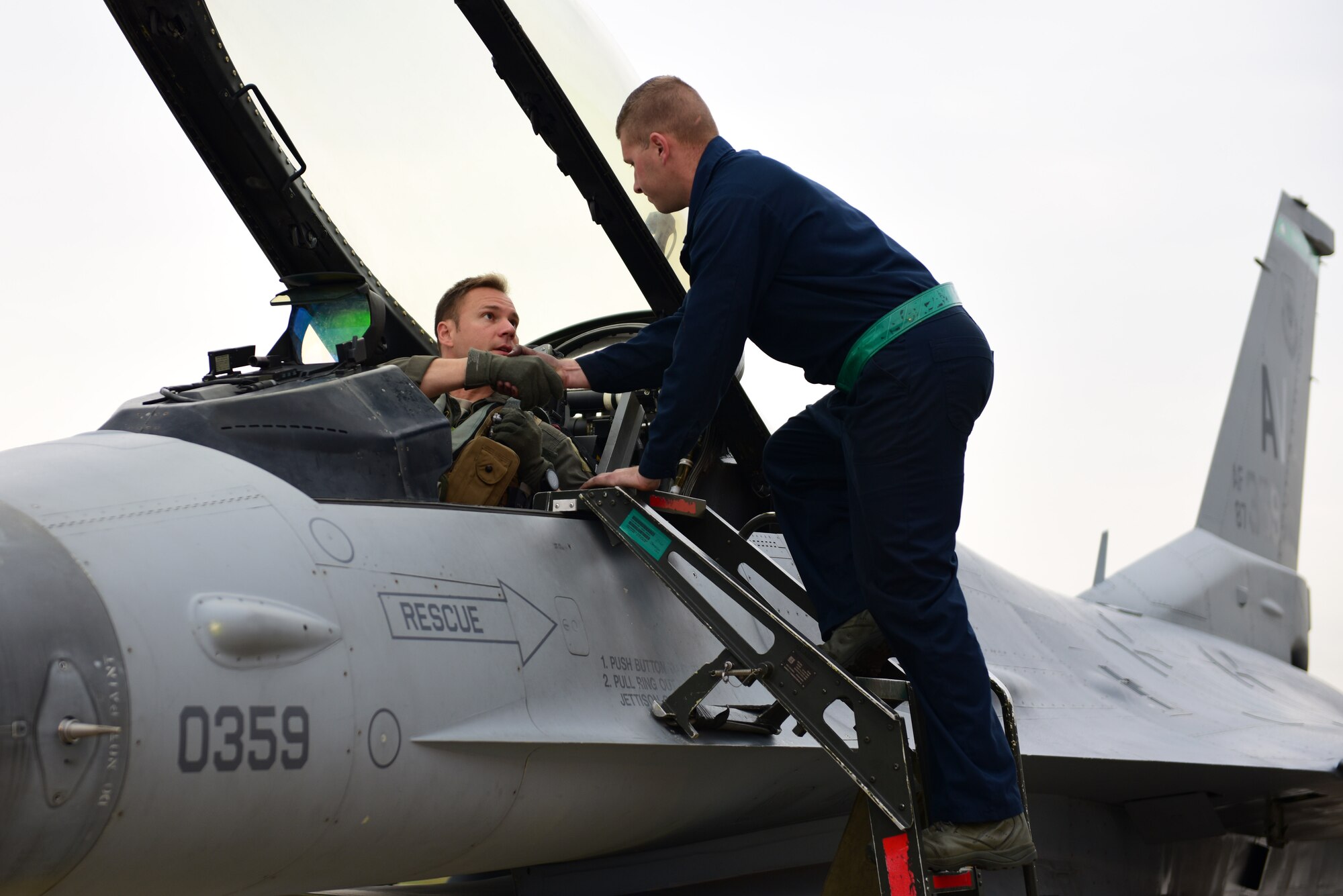U.S. Air Force Lt. Col. Beau E. Diers, 555th Fighter Squadron commander, shakes hands with Airman 1st Class Kalib Finley, 31st Aircraft Maintenance Squadron, 555th Aircraft Maintenance Unit crew chief, prior to takeoff preparations for Nickel Strike at Aviano Air Base, Sept. 25, 2019.